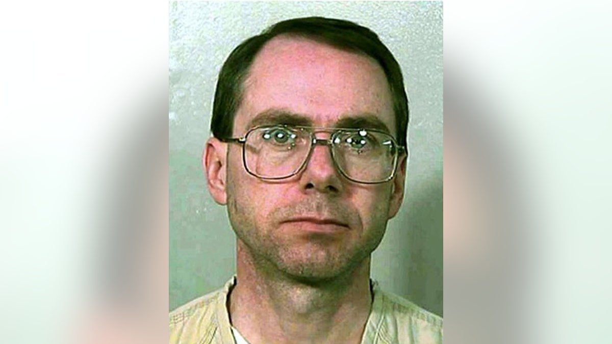 Mugshot of Terry Nichols wearing glasses.
