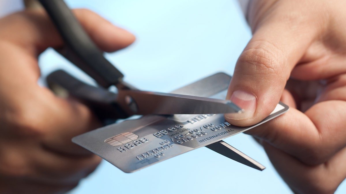 Scissors cutting up a credit card