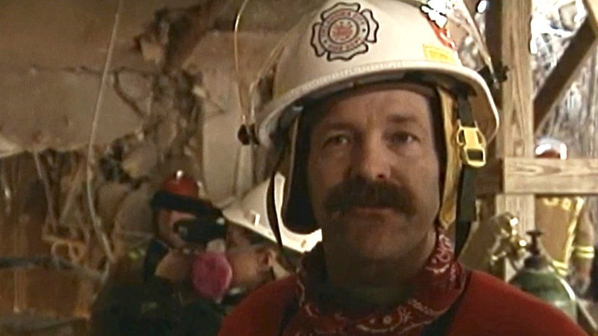 A close-up of Mike Shannon speaking to reporters inside the building where the Oklahoma City bomb took place.