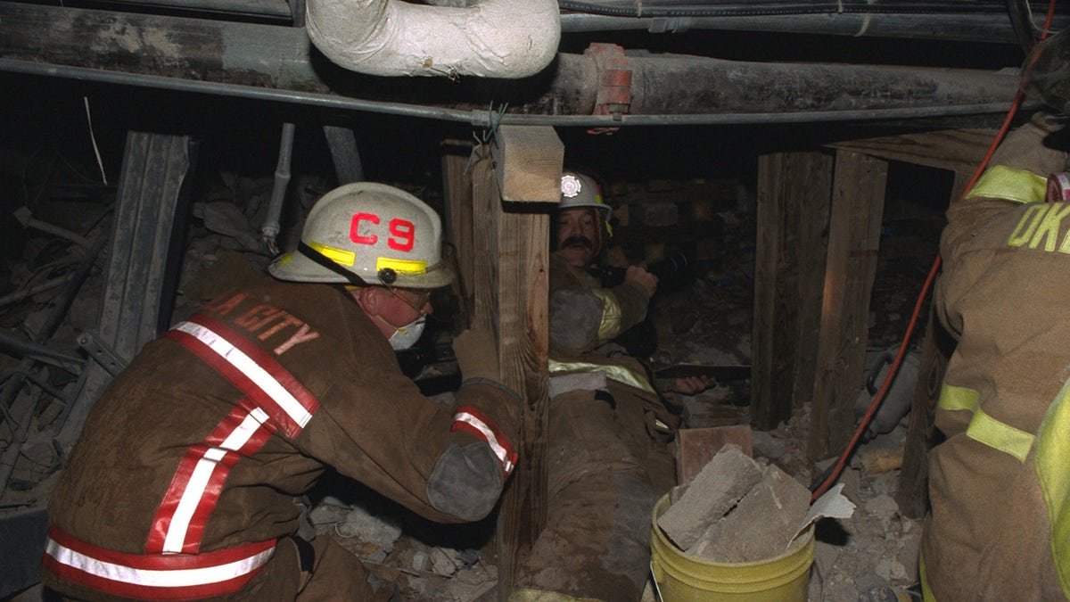 Firefighters going through the rubble looking for survivors.