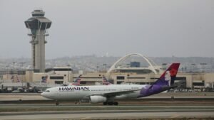 Hawaiian Airlines flight declares emergency after a mobile device gets stuck in seat, emits 'electrical smell'