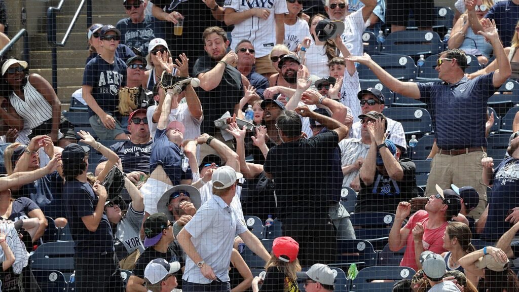 Dad goes viral after catching ball at Yankees game while daughter covers his eyes