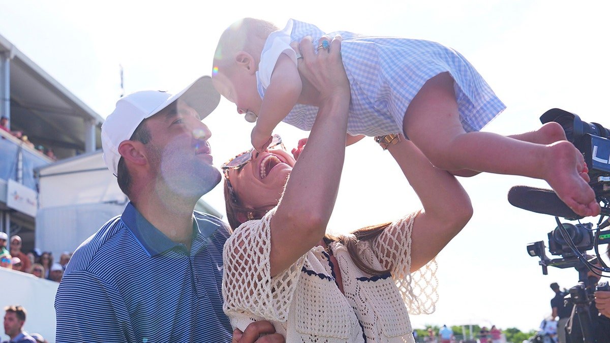 Scottie Scheffler and his wife Meredith with their son