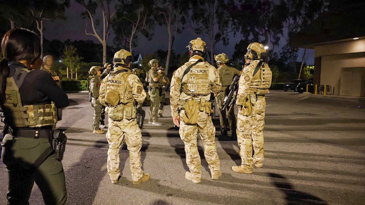 ICE agents on the street in Irvine, Calif.