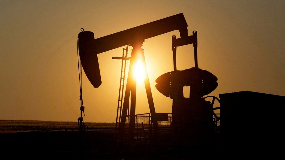 An oil pump jack pumps oil in a field near Calgary, Alberta, Canada on July 21, 2014.