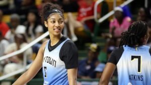 Sky star Angel Reese reacts after slapping clipboard out of coach’s hand