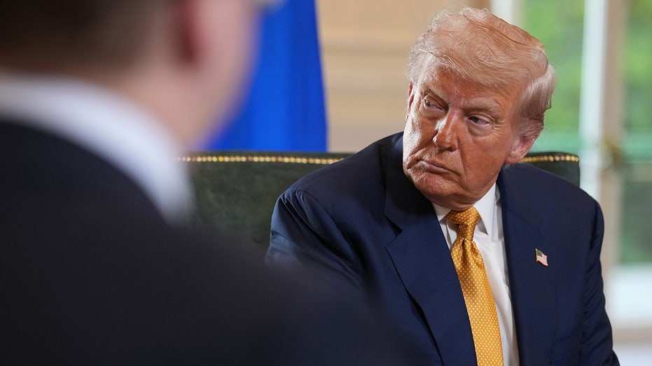 U.S. President Donald Trump listens during meeting