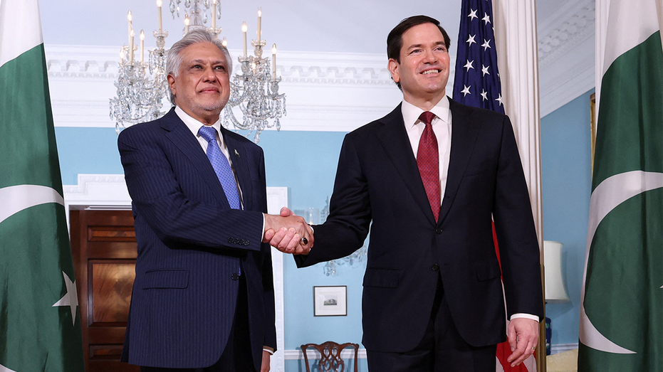 Pakistani Deputy Prime Minister and Foreign Minister Ishaq Dar shakes hands with U.S. Secretary of State Marco Rubio