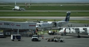 WestJet passengers evacuate on slides after engine fire at Vancouver airport