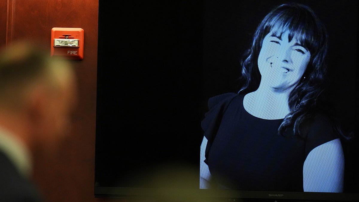 Angela Craig's photo on screen in courtroom