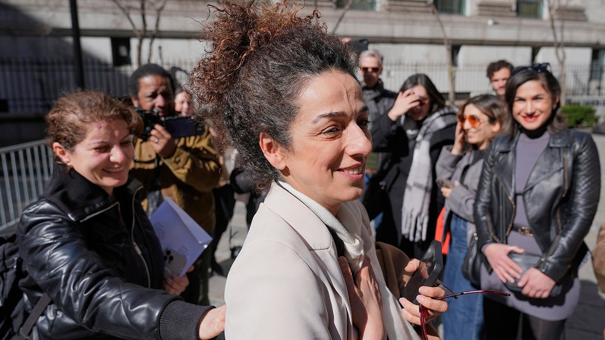 Masih Alinejad greets friends and supporters outside the federal courthouse