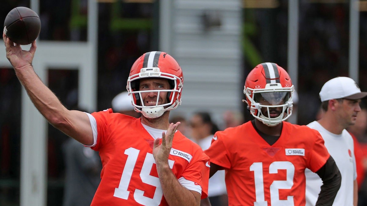 Joe Flacco throws as Shedeur Sanders looks on during Browns training camp July 25, 2025, in Berea, Ohio.