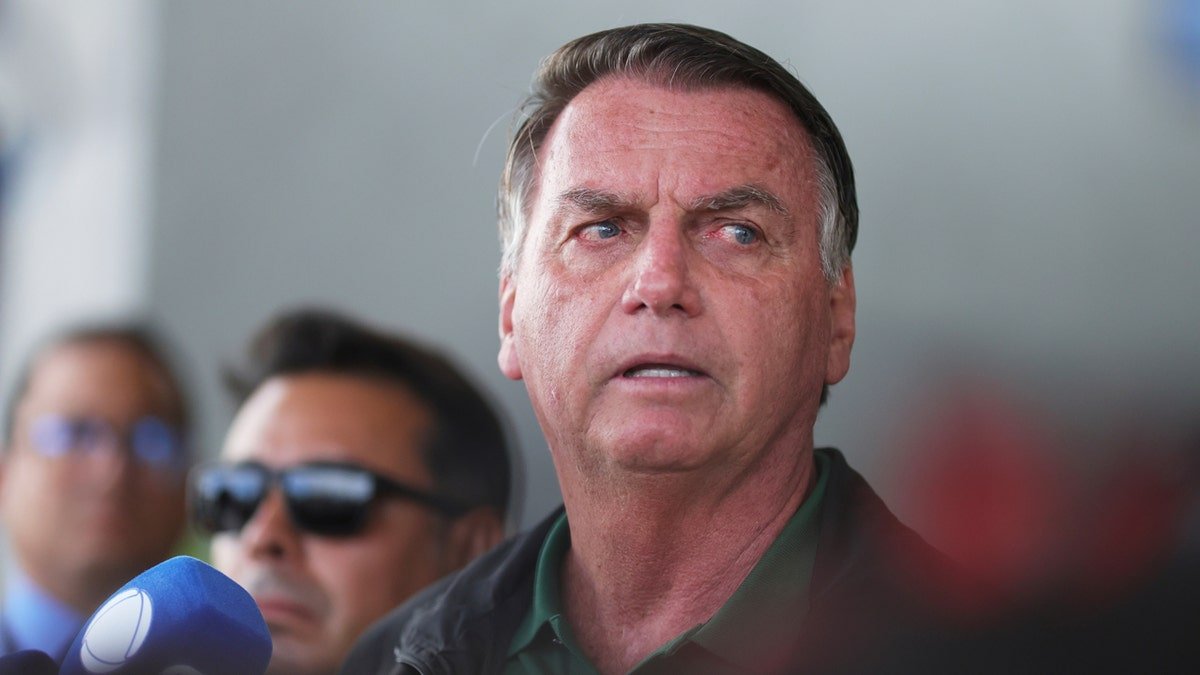Brazil's former President Jair Bolsonaro speaks to the press