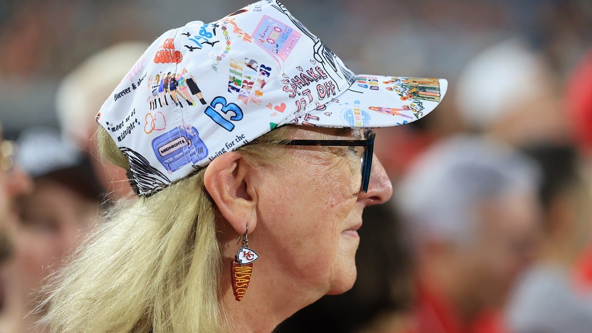 Taylor Swift-themed hat on top of Donna Kelce's hat