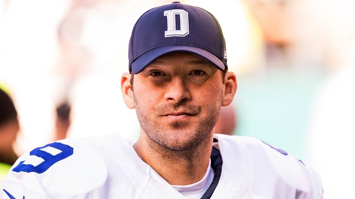 Tony Romo looks on