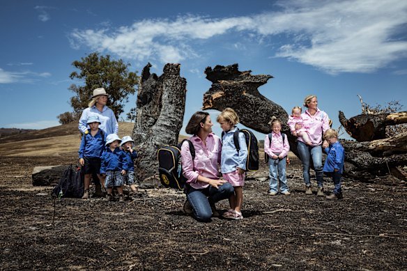 Annabelle Cleeland (centre) and daughter Quinn; Lou Webb (left) with Tom, Fred and George, and Felicity Jeffrey (right) with Jemima, Sebastian and Claudia in Whiteheads Creek.
