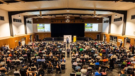 Between 600 and 700 people file into the thrice-yearly Mansfield State High School auction. 