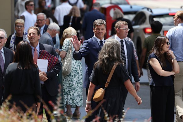 Liberal defence spokesman Angus Taylor  leaves the funeral. 