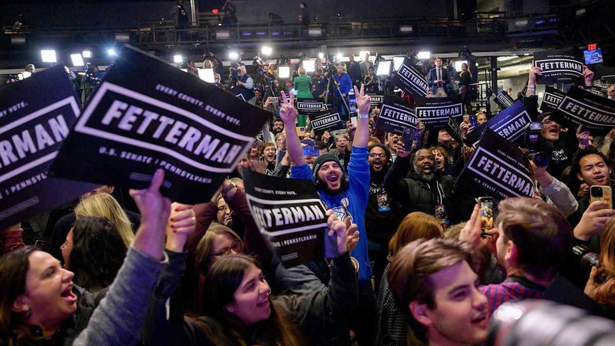 John Fetterman supporters react at watch party during 2022 midterms