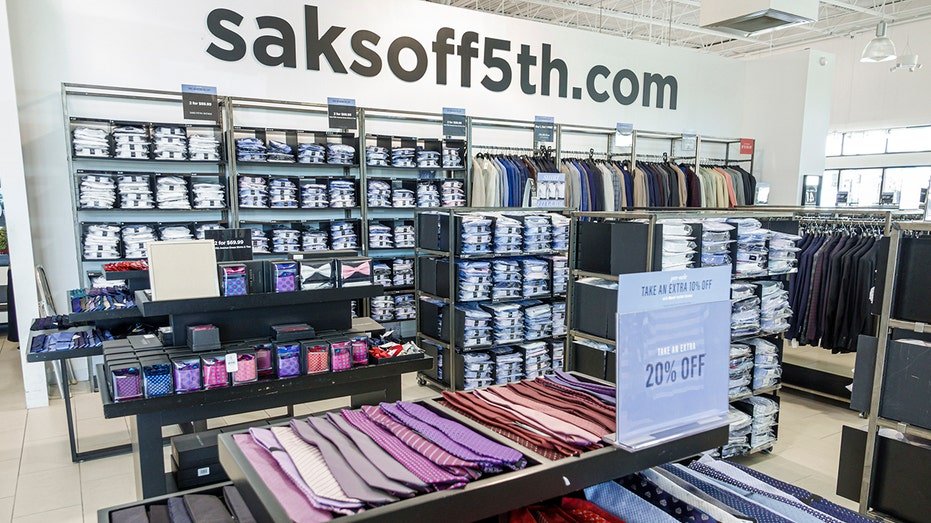 Ties and shirts are seen for sale inside a Saks OFF 5TH store