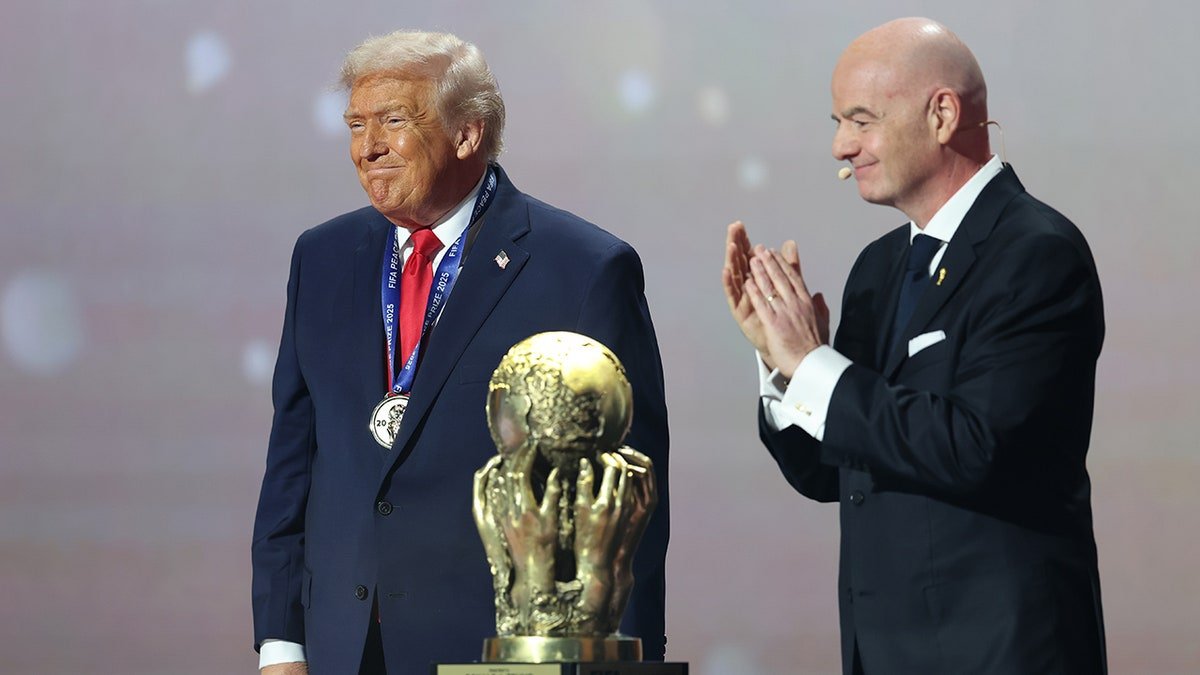 Trump with Infantino on stage