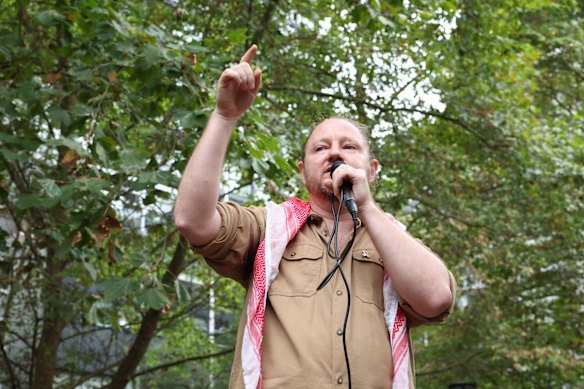 Palestine Action Group spokesman Josh Lees speaks to the crowd at Surry Hills. 