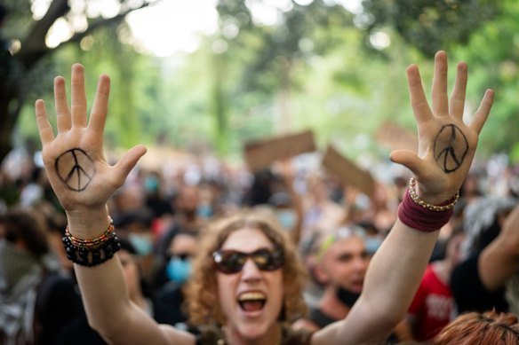 Hundreds of people gathered to demonstrate against police brutality and the visit to Australia by Israeli President Isaac Herzog on Tuesday.