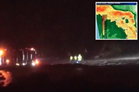 Frantic search for driver swept away by raging SoCal floodwaters after clinging to truck’s roof