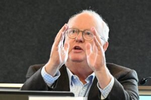 Geoffrey Watson backs administrator Mark Irving at Queensland hearing despite anger over report changes