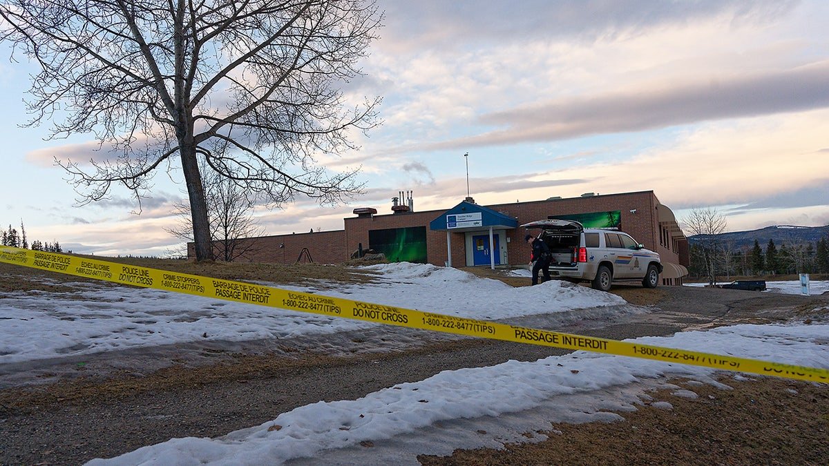 Police tape surrounds the Tumbler Ridge Secondary School and other buildings in Tumbler Ridge, B.C. on Wednesday, Feb. 11, 2026. (Jesse Boily /The Canadian Press via AP)