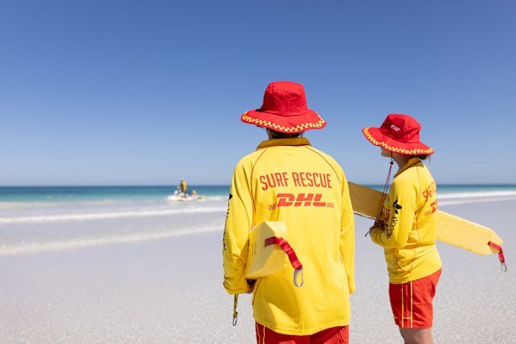 Surf lifesavers, in their familiar red and yellow, are volunteers. 
