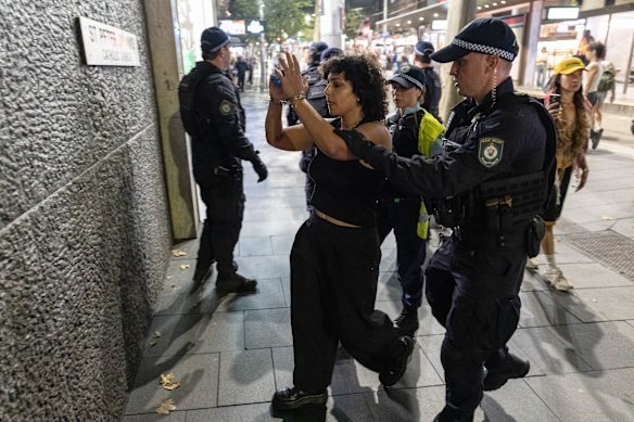 Palestine Action Group members and supporters hold a protest and eventually clash with police near Sydney Town Hall on February 9.