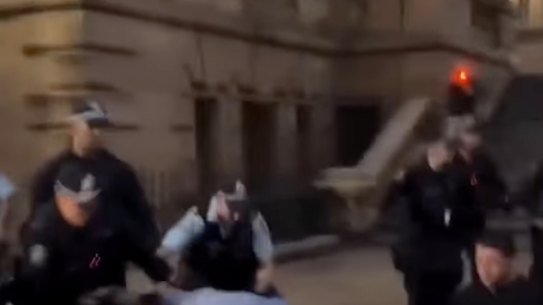From the video of a policeman seizing the man praying and throwing him to the ground outside Sydney Town Hall on Monday night.
