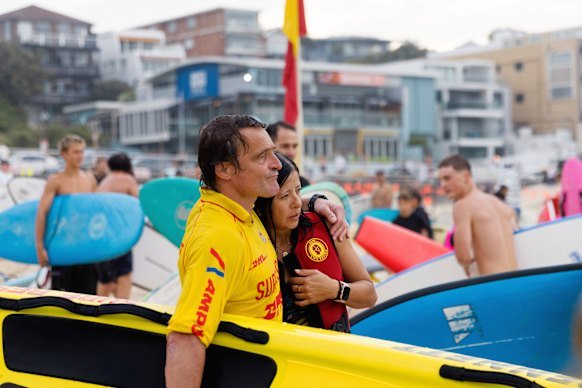 Parents of shark attack victim Nico Antic, Juan Pablo and Lorena Antic, return to the beach after a memorial paddle out in Nico’s honour. 