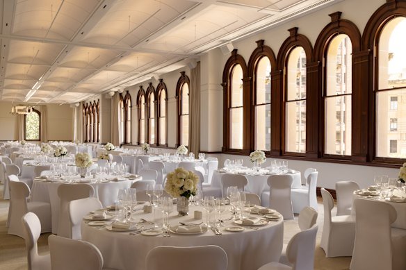 The Capella Ballroom features soaring ceilings and original arched cedar windows that fill the grand space with natural light. 