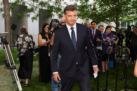 Angus Taylor leaves after making his statement.