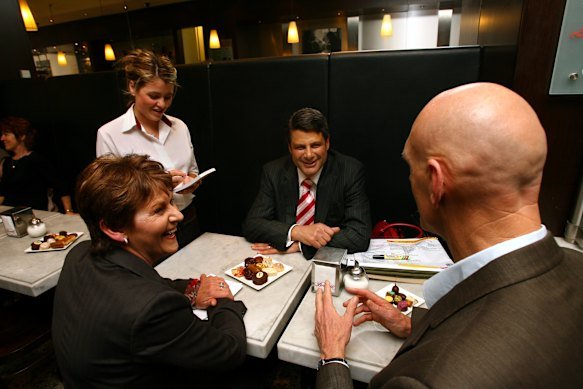 Then-premier Steve Bracks with then-minister Bronwyn Pike and Midnight Oil frontman (then a federal MP) Peter Garrett at Brunetti in 2006.