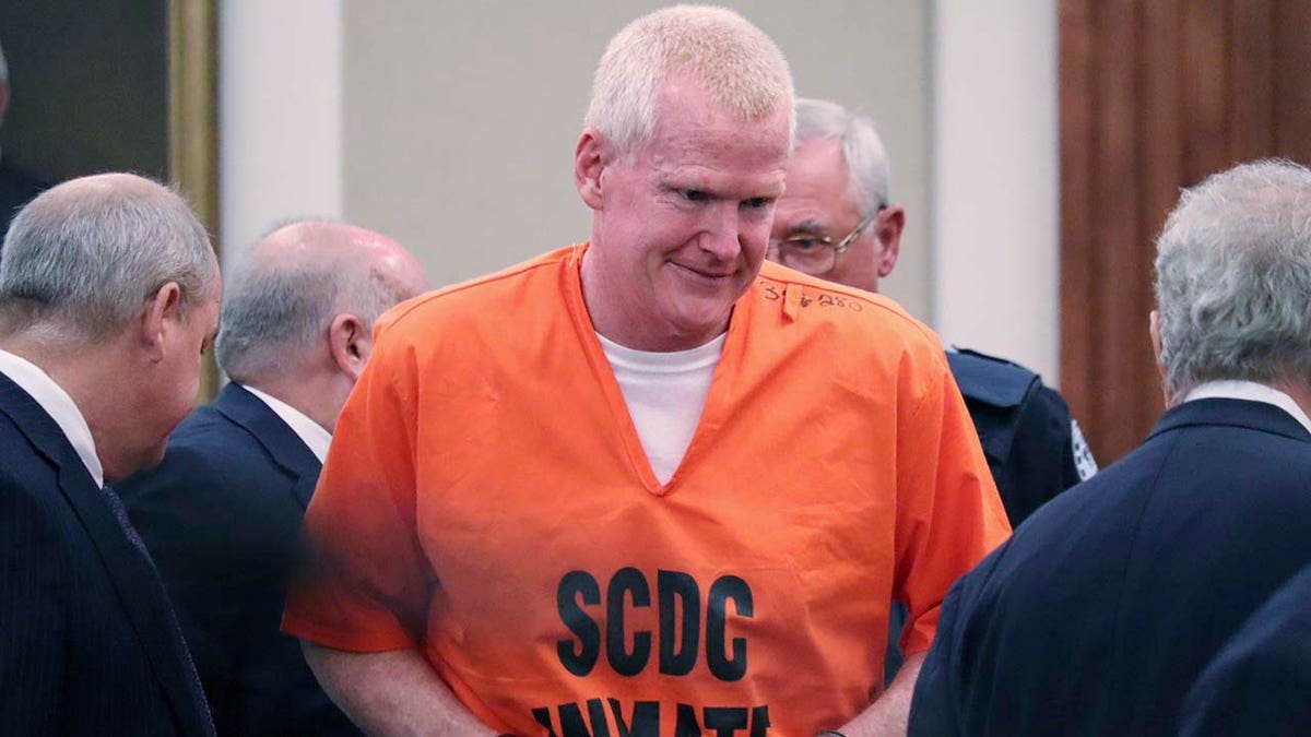 Alex Murdaugh arrives in court in Beaufort, South Carolina wearing an orange jumpsuit.