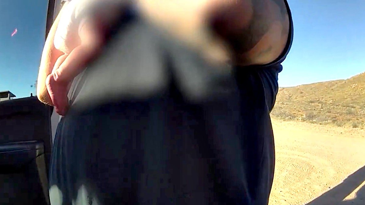 first responder holding baby after saving it from choking