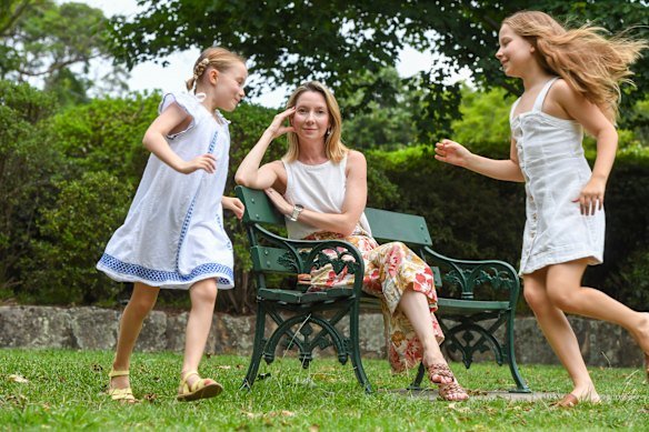 Lauren Martyn-Jones with her daughters Lillian, 8, and Eleanor, 7, says outdated school and work structures leave parents – especially mothers – with peak stress during long school holidays when their leave has ended.