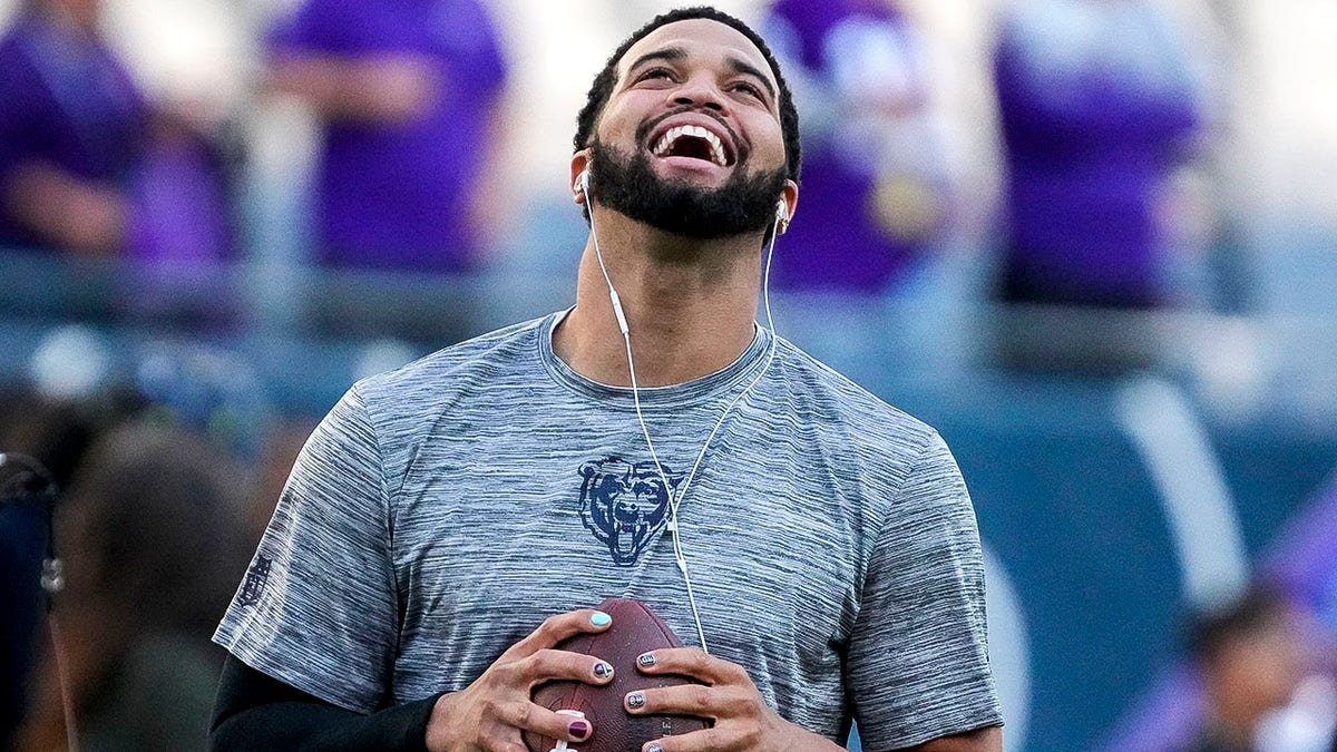 Caleb Williams smiles on field