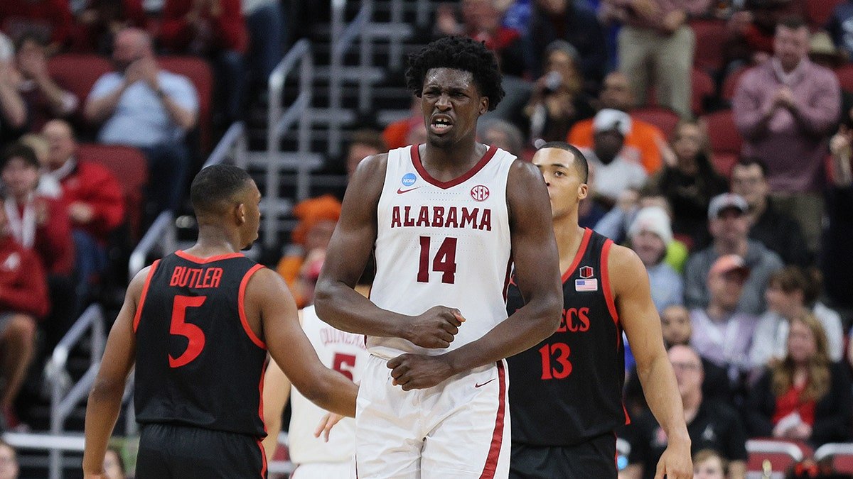 Charles Bediako reacts on court