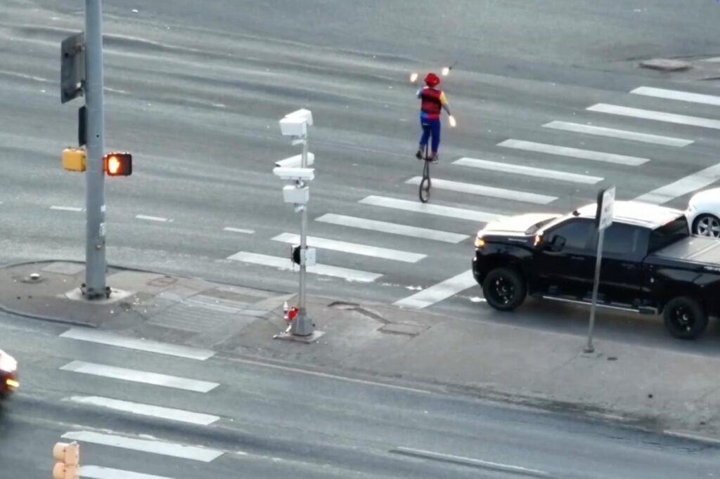 Fire-juggling unicyclist turns Colorado intersection into impromptu street show: ‘Certainly not on our Bingo card’