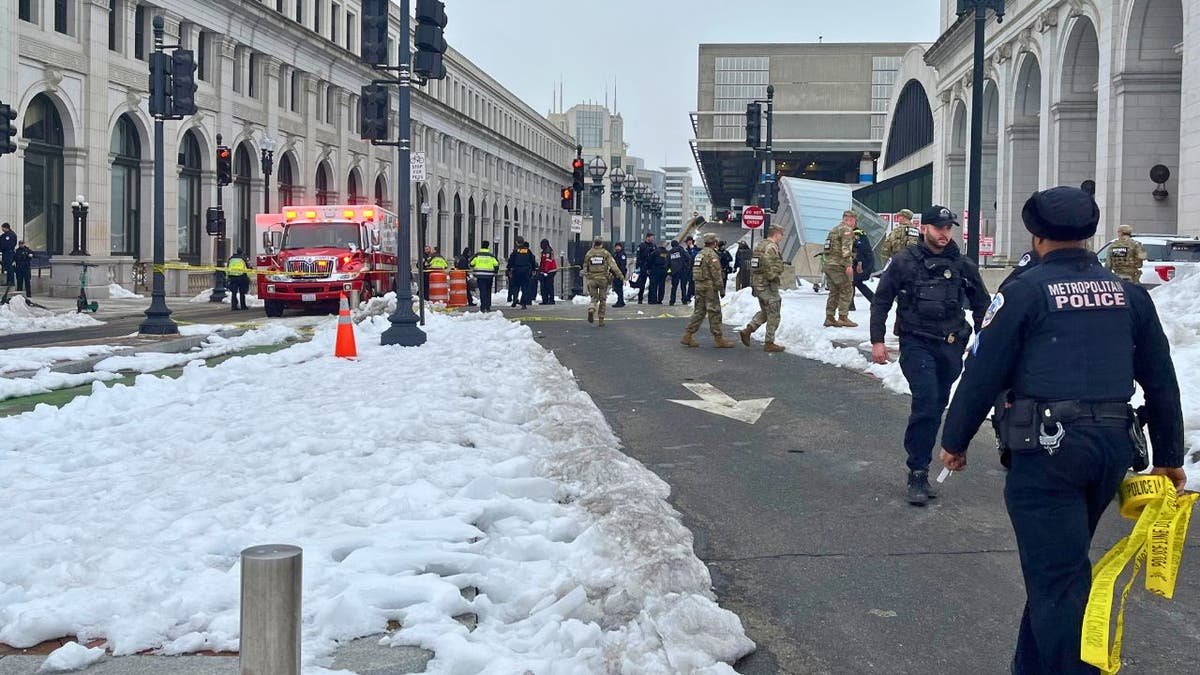 Police vehicles and officers respond to a shooting near the Capitol complex in Washington, D.C.