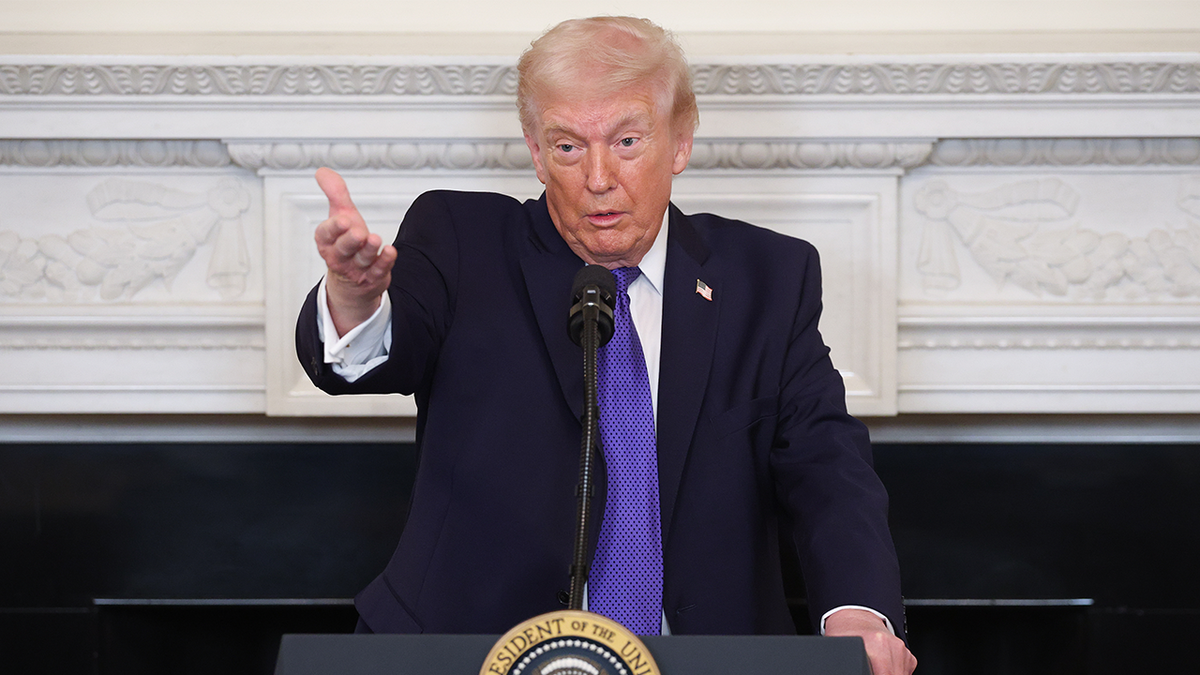President Donald Trump at a podium.