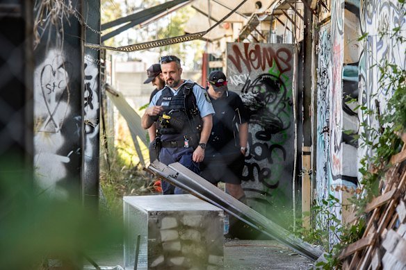 Police at the scene after a fire at the Homebush Theatre.