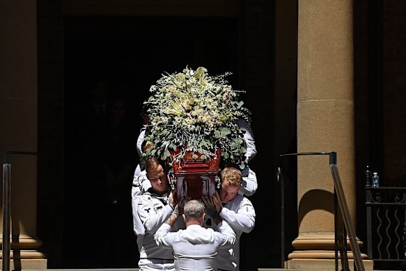 Australian navy personnel carry the coffin of Dame Marie Bashir the 37th Governor of NSW from St James Church in Sydney following her state funeral.