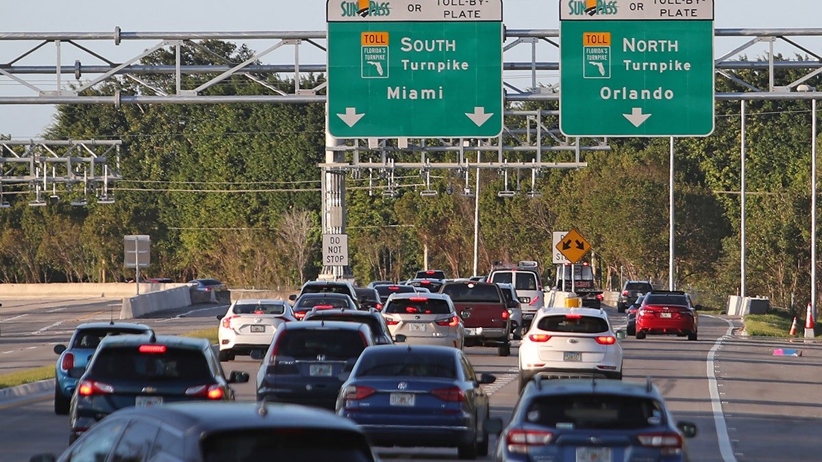Cars are backed up on a Florida turnpike.