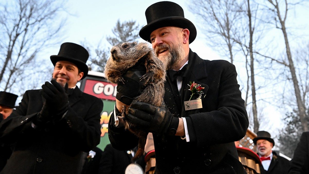 Groundhog Club handler A.J. Dereume holds Punxsutawney Phil