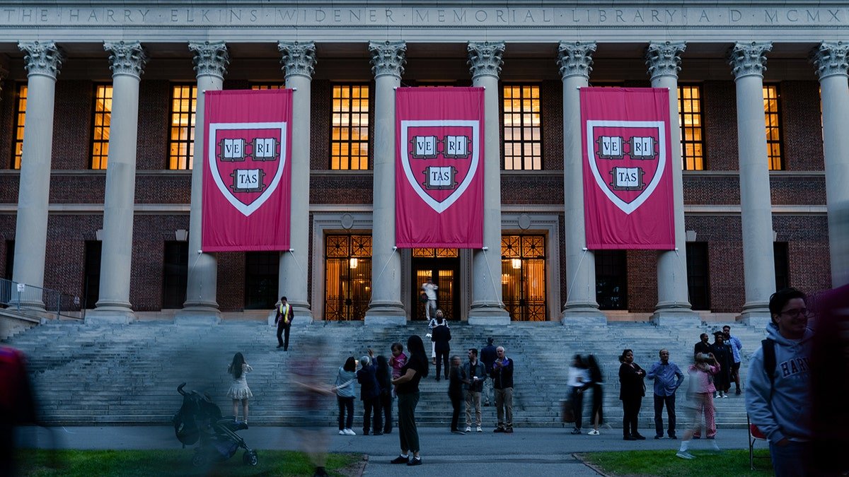Harvard University banners hang in May 2025